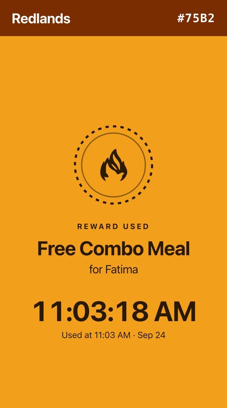 Full-screen saffron reward confirmation reading Reward used, Free Combo Meal, with a live clock.